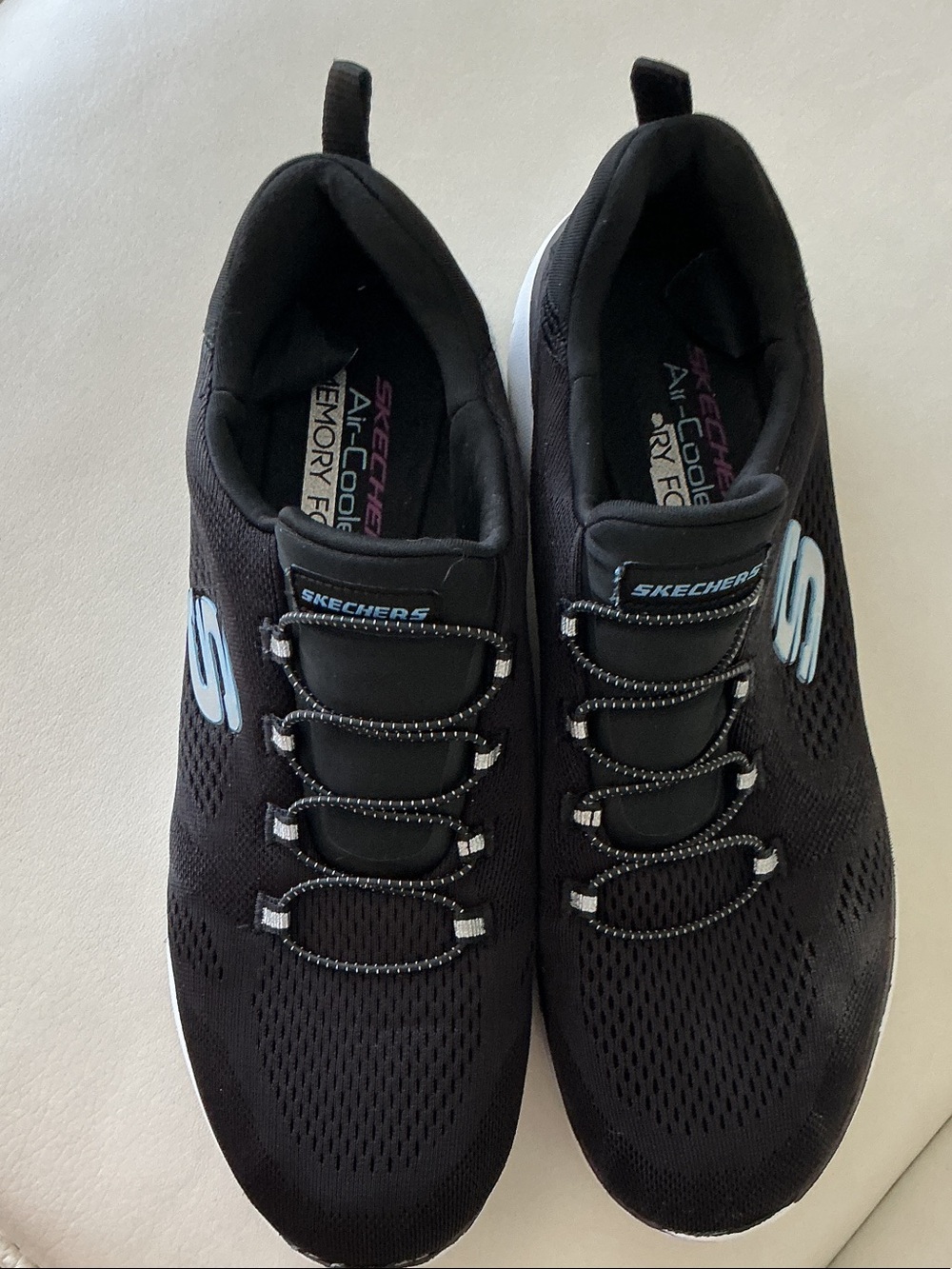 Skechers - Women's Black Athletic Slip-On Sneakers with Light Blue Logo